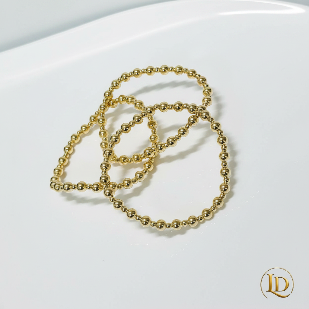 Lumiere Gold Stack - polished gold bead bracelets